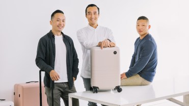 The co-founders of Monos show off their luggage