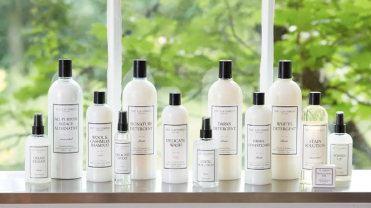 White bottles of the Laundress detergent and other cleaning products